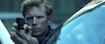 Movie still from “Phone Booth” (2002), directed by Joel Schumacher – A person holding a car window; Close Up shot, Low angle