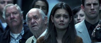 Movie still from “Phone Booth” (2002), directed by Joel Schumacher – An older man and a young woman looking at something; Close Up shot, Over the shoulder angle