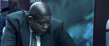 Movie still from “Phone Booth” (2002), directed by Joel Schumacher – A man in a suit and tie; Close Up shot, Low angle