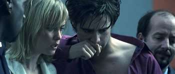 Movie still from “Phone Booth” (2002), directed by Joel Schumacher – A man and a woman looking at each other; Close Up shot, Over the shoulder angle