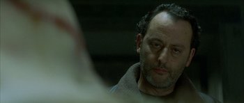 Movie still from “The Crimson Rivers” (2000), directed by Mathieu Kassovitz – A person looking at a mirror; Close Up shot, Over the shoulder angle