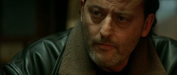 Movie still from “The Crimson Rivers” (2000), directed by Mathieu Kassovitz – A person wearing a jacket; Close Up shot, Over the shoulder angle