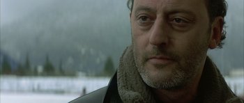 Movie still from “The Crimson Rivers” (2000), directed by Mathieu Kassovitz – A person wearing a jacket; Close Up shot, Over the shoulder angle