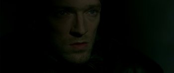 Movie still from “The Crimson Rivers” (2000), directed by Mathieu Kassovitz – A man's face in the dark; Close Up shot, High angle