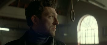 Movie still from “The Crimson Rivers” (2000), directed by Mathieu Kassovitz – A person looking up at something; Close Up shot, Low angle