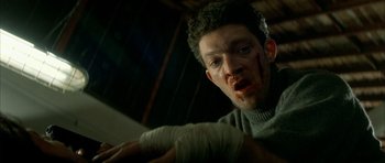 Movie still from “The Crimson Rivers” (2000), directed by Mathieu Kassovitz – A person with bandages on; Close Up shot, Low angle