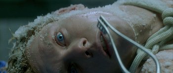 Movie still from “The Crimson Rivers” (2000), directed by Mathieu Kassovitz – A woman's face with a toothbrush in her mouth; Extreme Close Up shot, Overhead angle
