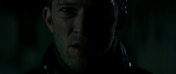 Movie still from “The Crimson Rivers” (2000), directed by Mathieu Kassovitz – A man's face in the dark; Close Up shot, Low angle