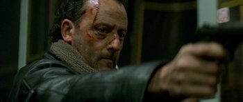 Movie still from “The Crimson Rivers” (2000), directed by Mathieu Kassovitz – A person with a scar on his face; Close Up shot, High angle