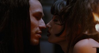 Movie still from “The Crow” (1994), directed by Alex Proyas – A man and a woman face to face in the dark; Close Up shot, Low angle