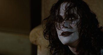 Movie still from “The Crow” (1994), directed by Alex Proyas – A person with a face paint; Close Up shot, Low angle