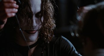 Movie still from “The Crow” (1994), directed by Alex Proyas – A person wearing a mask; Close Up shot, Low angle