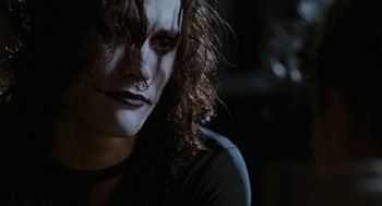 Movie still from “The Crow” (1994), directed by Alex Proyas – A person wearing a mask; Close Up shot, Low angle