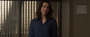 Movie still from “The Curse of La Llorona” (2019), directed by Michael Chaves – A woman in a blue shirt looking up; Medium shot, Over the shoulder angle