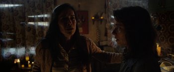 Movie still from “The Curse of La Llorona” (2019), directed by Michael Chaves – A woman and a man in a room with lights on; Close Up shot, Over the shoulder angle