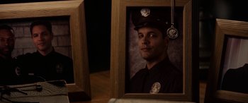 Movie still from “The Curse of La Llorona” (2019), directed by Michael Chaves – A picture of a police officer in a picture frame; Close Up shot, Over the shoulder angle