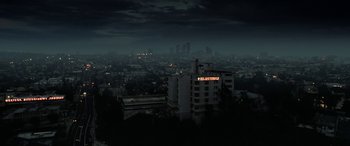 Movie still from “The Curse of La Llorona” (2019), directed by Michael Chaves – A view of a city at night from a hill; Extreme Wide shot, High angle