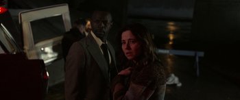 Movie still from “The Curse of La Llorona” (2019), directed by Michael Chaves – A man and a woman standing next to each other; Medium shot, Over the shoulder angle