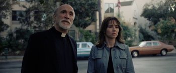 Movie still from “The Curse of La Llorona” (2019), directed by Michael Chaves – A man and a woman standing next to each other on the street; Medium shot, Low angle