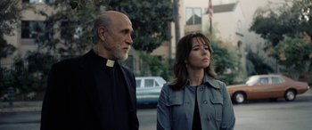 Movie still from “The Curse of La Llorona” (2019), directed by Michael Chaves – A man and a woman standing next to each other on the street; Medium shot, Over the shoulder angle
