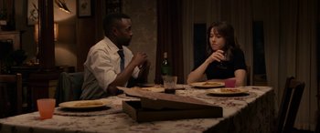 Movie still from “The Curse of La Llorona” (2019), directed by Michael Chaves – A man and a woman sitting at a dinner table; Medium shot, Over the shoulder angle