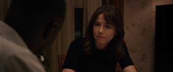 Movie still from “The Curse of La Llorona” (2019), directed by Michael Chaves – A person sitting at a table; Close Up shot, Over the shoulder angle