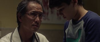 Movie still from “The Curse of La Llorona” (2019), directed by Michael Chaves – A man and a boy talking to each other in a room; Close Up shot, Over the shoulder angle