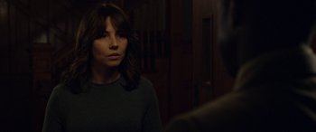 Movie still from “The Curse of La Llorona” (2019), directed by Michael Chaves – A woman standing in front of a mirror in a dark room; Close Up shot, Over the shoulder angle