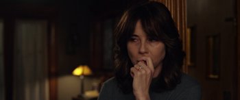 Movie still from “The Curse of La Llorona” (2019), directed by Michael Chaves – A person holding their hand to her mouth; Close Up shot, Over the shoulder angle