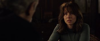 Movie still from “The Curse of La Llorona” (2019), directed by Michael Chaves – A person sitting in front of another person; Close Up shot, Over the shoulder angle