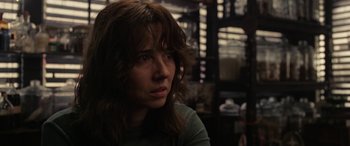 Movie still from “The Curse of La Llorona” (2019), directed by Michael Chaves – A person sitting in front of a window; Close Up shot, Over the shoulder angle