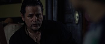 Movie still from “The Curse of La Llorona” (2019), directed by Michael Chaves – A person wearing a black shirt; Close Up shot, Over the shoulder angle