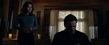 Movie still from “The Curse of La Llorona” (2019), directed by Michael Chaves – A man and a woman in a living room; Medium shot, Over the shoulder angle