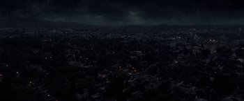 Movie still from “The Curse of La Llorona” (2019), directed by Michael Chaves – A view of a city at night from a plane window; Extreme Wide shot, High angle
