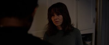 Movie still from “The Curse of La Llorona” (2019), directed by Michael Chaves – A woman looking at the camera in a dark room; Close Up shot, Over the shoulder angle