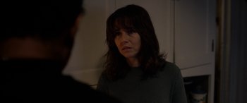 Movie still from “The Curse of La Llorona” (2019), directed by Michael Chaves – A woman looking at the camera in the dark; Close Up shot, Over the shoulder angle