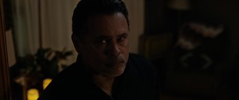 Movie still from “The Curse of La Llorona” (2019), directed by Michael Chaves – A person wearing a black shirt; Close Up shot, Over the shoulder angle