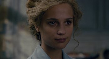 Movie still from “The Danish Girl” (2015), directed by Tom Hooper – A person wearing a blue shirt; Close Up shot, Over the shoulder angle