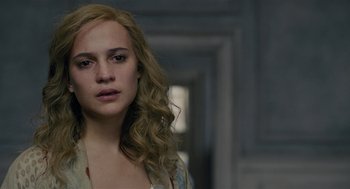 Movie still from “The Danish Girl” (2015), directed by Tom Hooper – A beautiful young woman with long blonde hair; Close Up shot, High angle