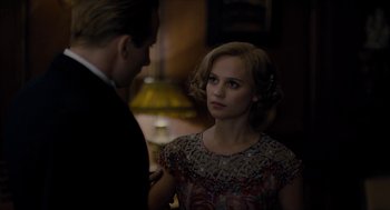 Movie still from “The Danish Girl” (2015), directed by Tom Hooper – A man and a woman standing next to each other in a room; Close Up shot, Over the shoulder angle
