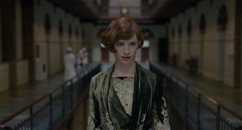 Movie still from “The Danish Girl” (2015), directed by Tom Hooper – A woman with red hair in a green dress; Close Up shot, Low angle