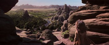 Movie still from “The Dark Crystal” (1982), directed by Frank Oz – A view of a valley with a river running through it; Extreme Wide shot, High angle