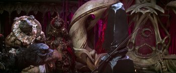 Movie still from “The Dark Crystal” (1982), directed by Frank Oz – A statue that is made out of a banana peel; Wide shot, High angle