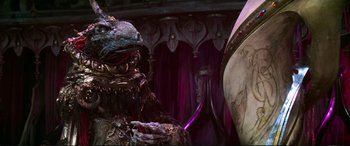 Movie still from “The Dark Crystal” (1982), directed by Frank Oz – An image of a creature in a room; Close Up shot, Low angle