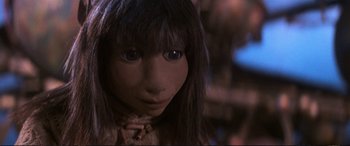 Movie still from “The Dark Crystal” (1982), directed by Frank Oz – The face of a young girl; Close Up shot, Low angle