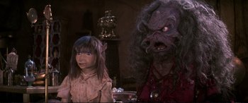 Movie still from “The Dark Crystal” (1982), directed by Frank Oz – A young girl and an older woman in costume; Close Up shot, Over the shoulder angle