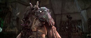 Movie still from “The Dark Crystal” (1982), directed by Frank Oz – The head of a creature; Close Up shot, High angle