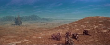 Movie still from “The Dark Crystal” (1982), directed by Frank Oz – An image of an alien landscape in the middle of the desert; Extreme Wide shot, High angle