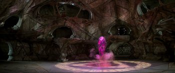 Movie still from “The Dark Crystal” (1982), directed by Frank Oz – A purple object in the middle of a room; Extreme Wide shot, High angle