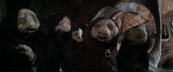 Movie still from “The Dark Crystal” (1982), directed by Frank Oz – A couple of stuffed animals that are next to each other; Close Up shot, Low angle